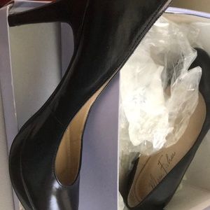 Black leather pumps